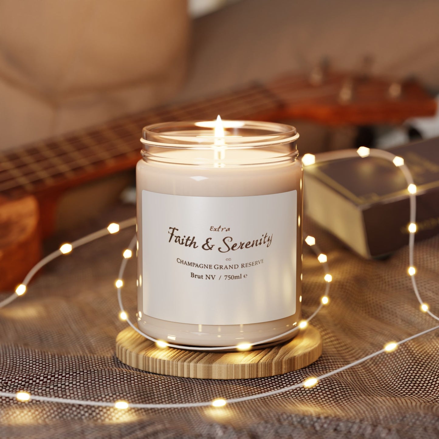 Candle in a glass jar with a wooden coaster on a table with string lights and a guitar in the background