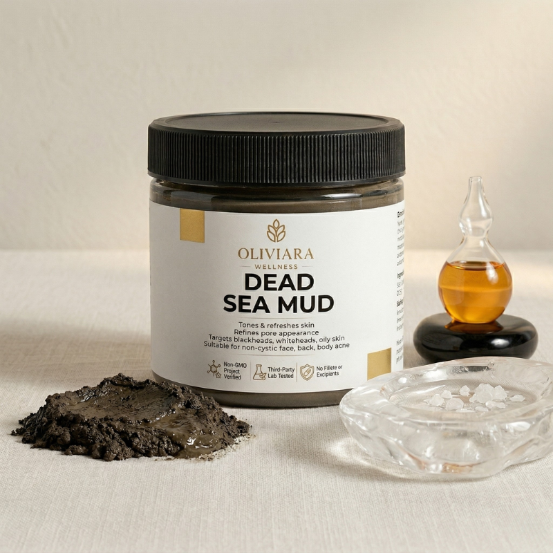 Dead Sea Mud jar with mud and oil bottle on a neutral background